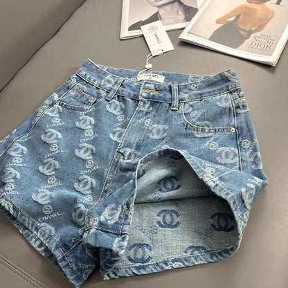 Denim shorts with all-over logo embroidery