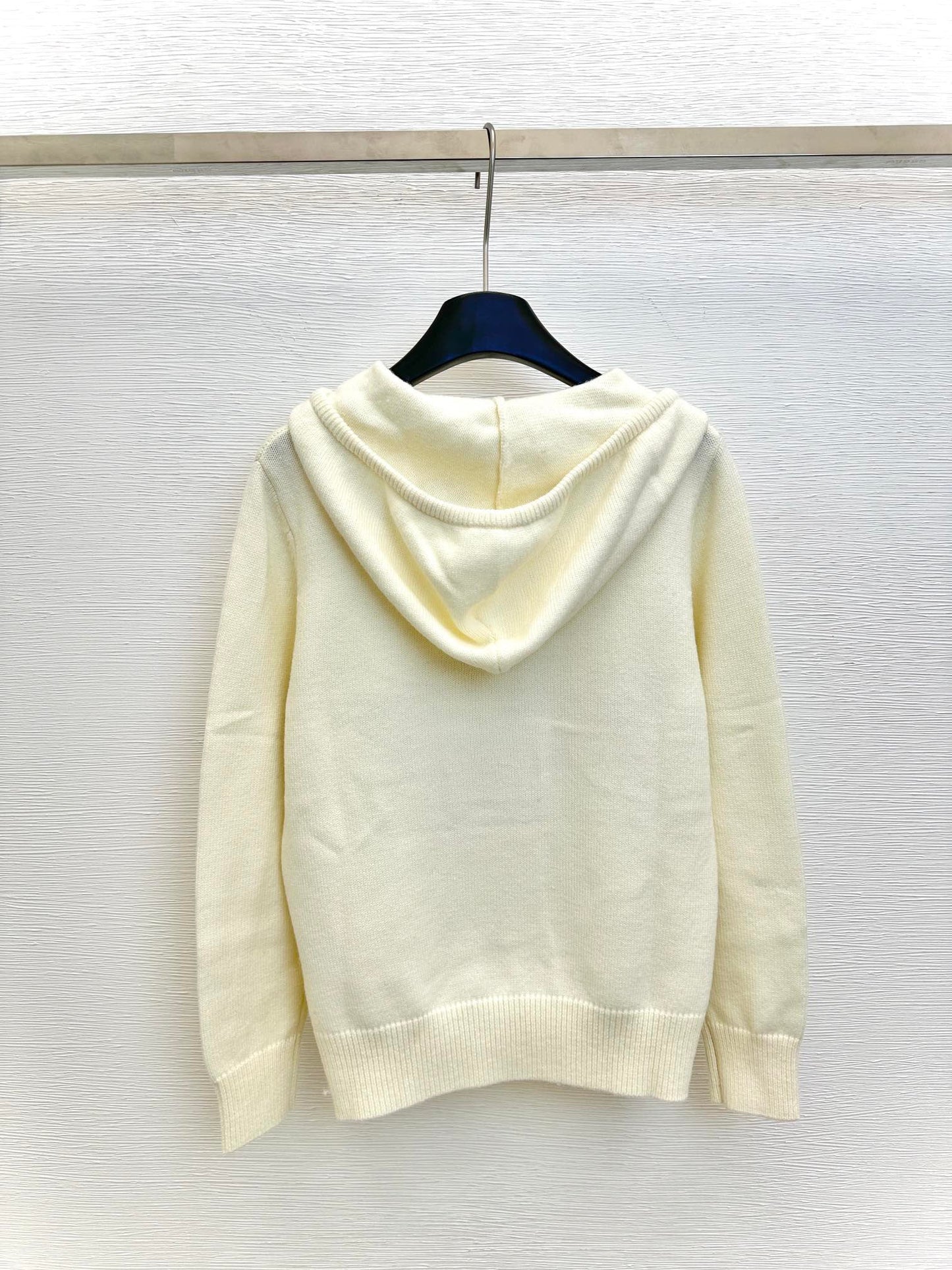 star embroidered hooded knit top