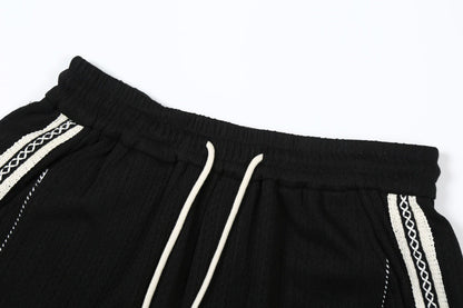 Web panel embroidered shorts